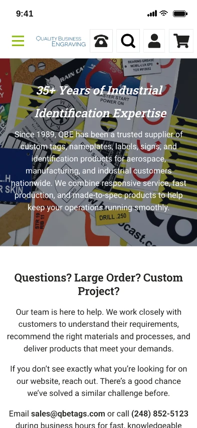 Quality Business Engraving website homepage on a phone